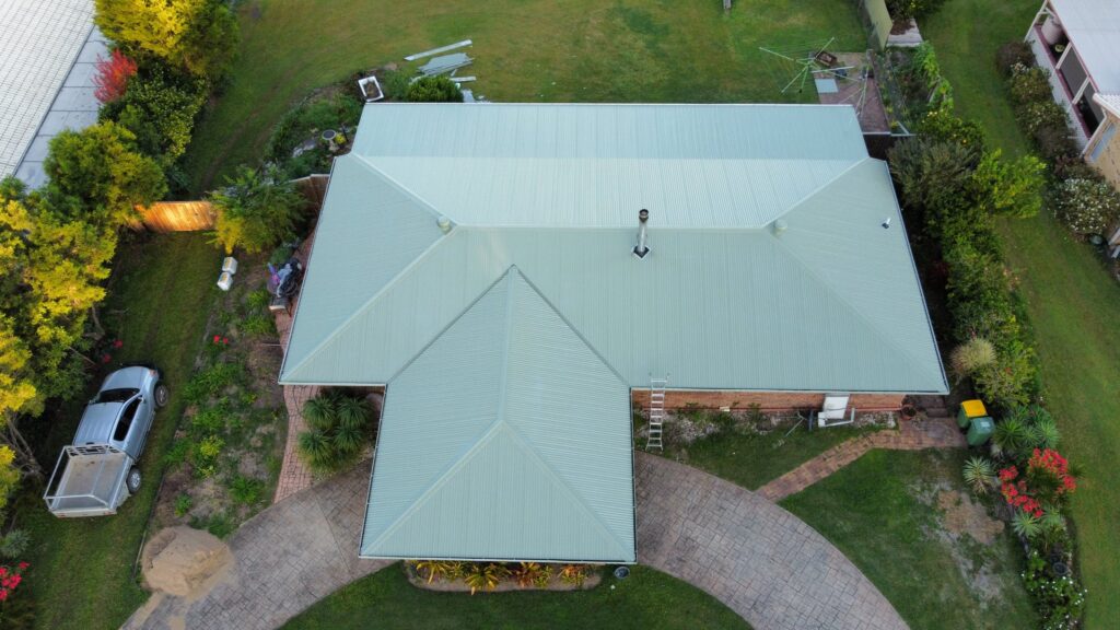 Aerial view of a pale green metal roof on a Sunshine Coast home