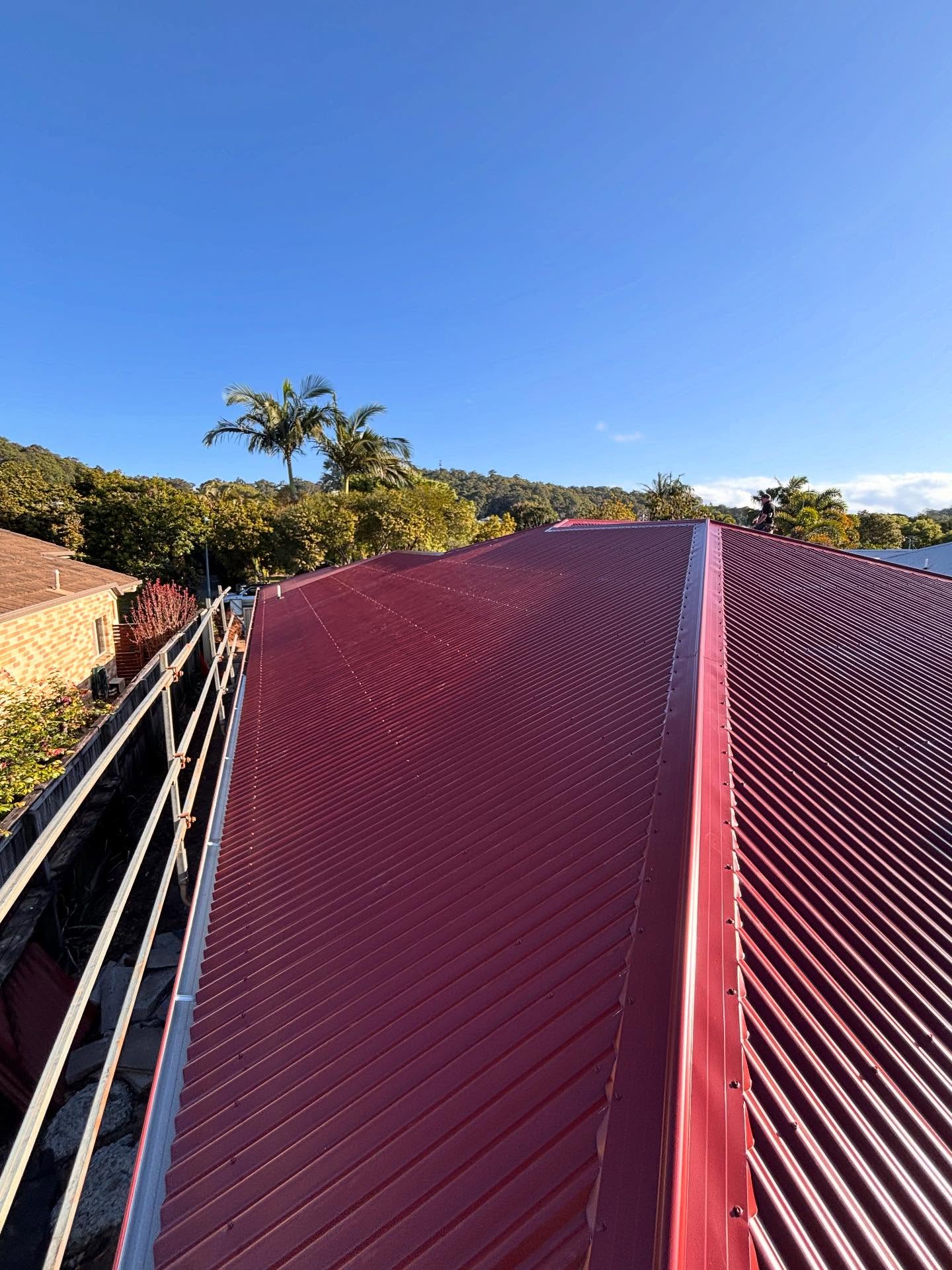 Red metal roof installed by Young Gunns Roofing in Bli Bli on the Sunshine Coast