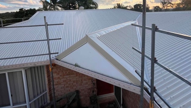New metal roof over a brick home, Sunshine Coast roofing by Young Gunns Roofing