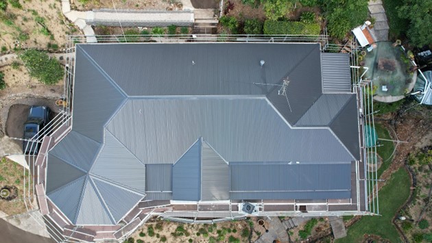 Metal roof on a family home, aerial view, Sunshine Coast roofing by Young Gunns Roofing