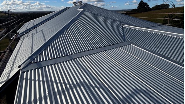 New metal roof on a multi-level home, Sunshine Coast roofing by Young Gunns Roofing